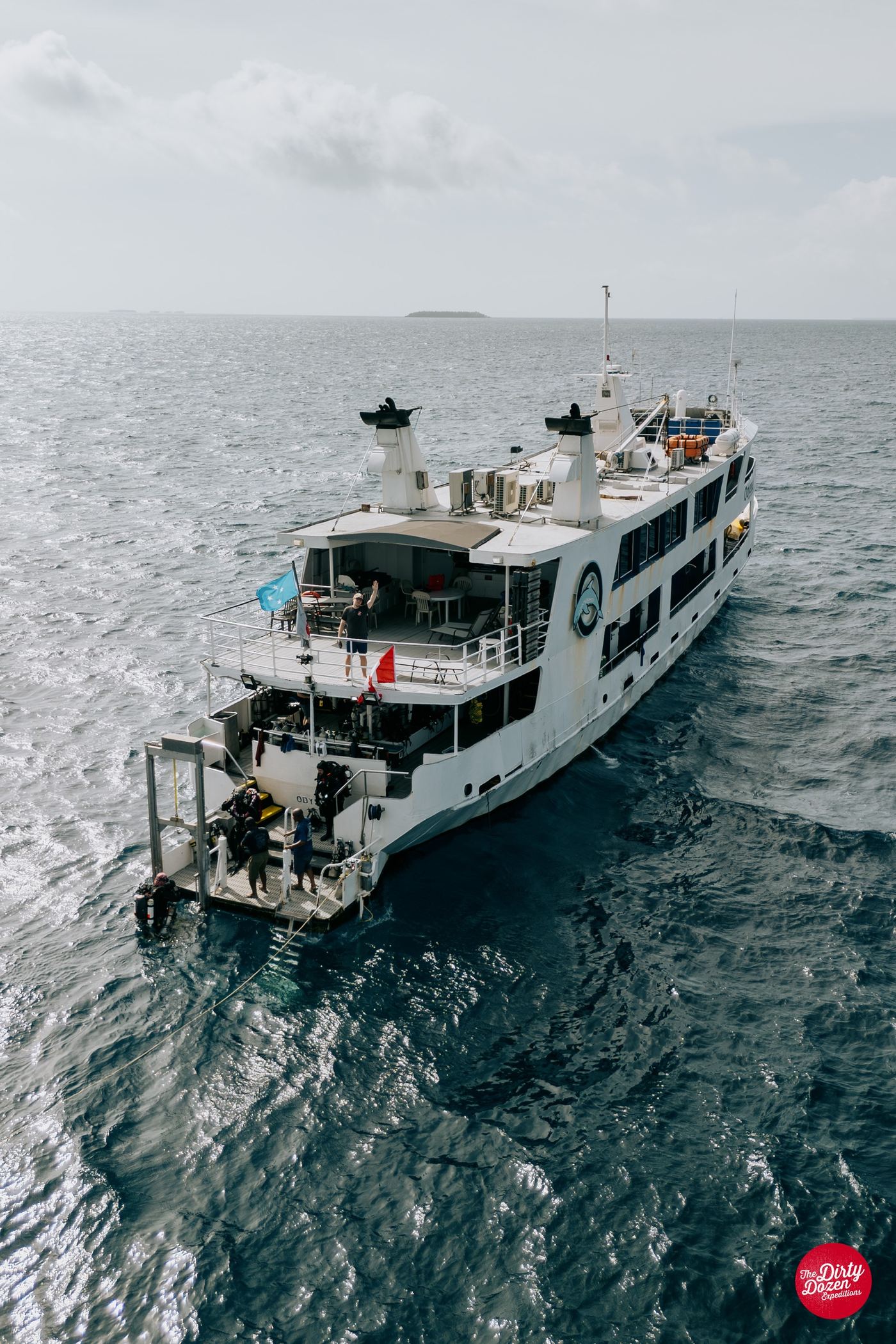 Divers off the stern of the Odyssey